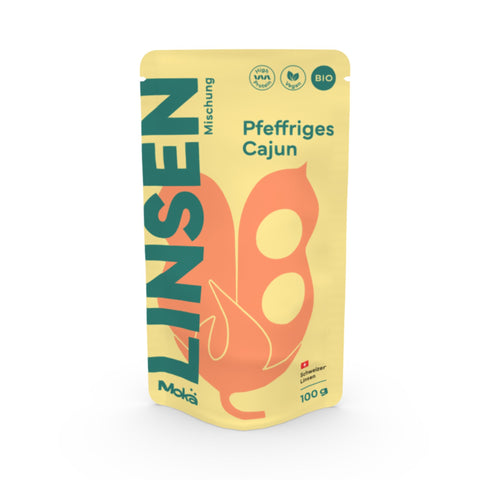 Mokä Pfeffriges Cajun Linsenmischung – Bio-Packung 100g, proteinreich und vegan. Frontalansicht zeigt Verpackungsform und Design.